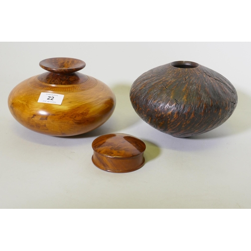 22 - Treen, a New Zealand Rimu and Totana burr wood turned pot, signed to base Jim Ross, 19cm diameter, a... 