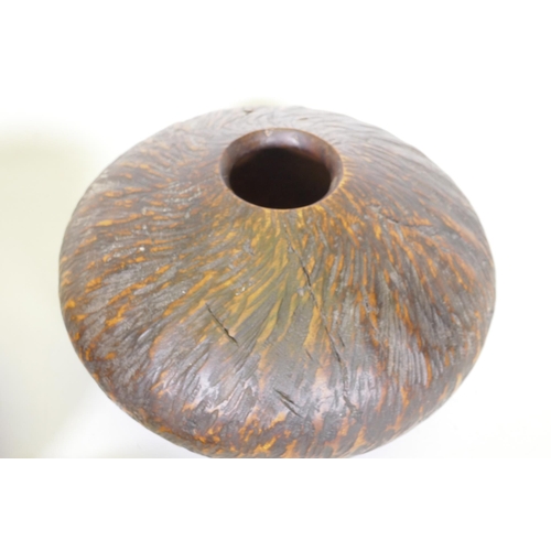 22 - Treen, a New Zealand Rimu and Totana burr wood turned pot, signed to base Jim Ross, 19cm diameter, a... 