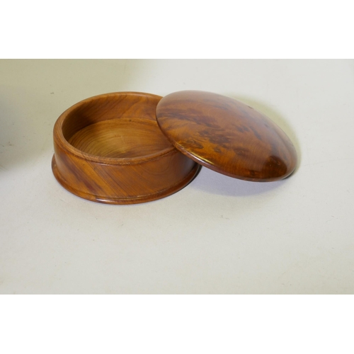 22 - Treen, a New Zealand Rimu and Totana burr wood turned pot, signed to base Jim Ross, 19cm diameter, a... 