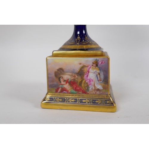 222 - A Vienna porcelain urn and cover, with gilt highlights and hand painted decoration depicting the tri... 