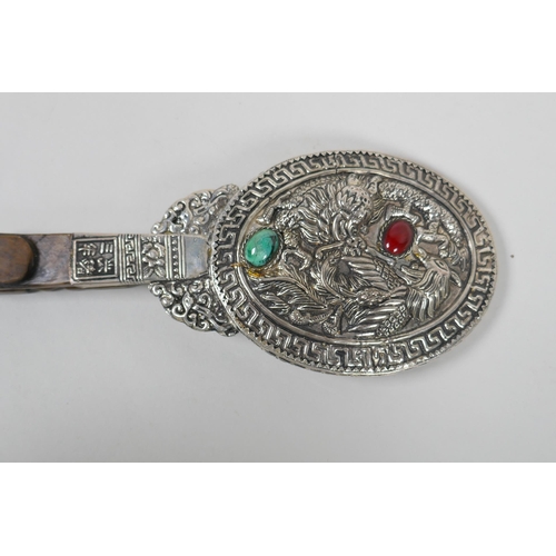 226 - A Chinese white metal hand mirror with repousse dragon and phoenix decoration and a carved hardstone... 