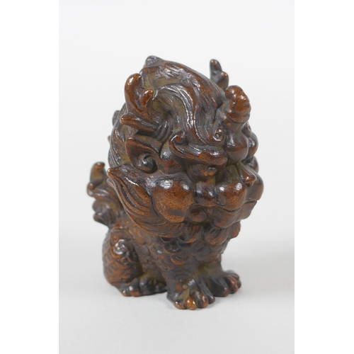 228 - An oriental cast bronze stylised figure of a kylin, 6cm high