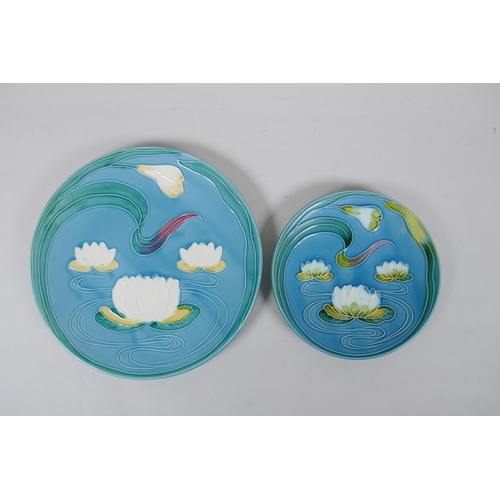 229 - Two West German blue ground majolica dishes with Art Nouveau lotus flower design, and another majoli... 