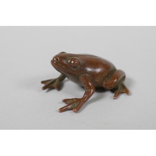 235 - A Japanese style bronze okimono frog, indistinct mark to belly, 4cm long