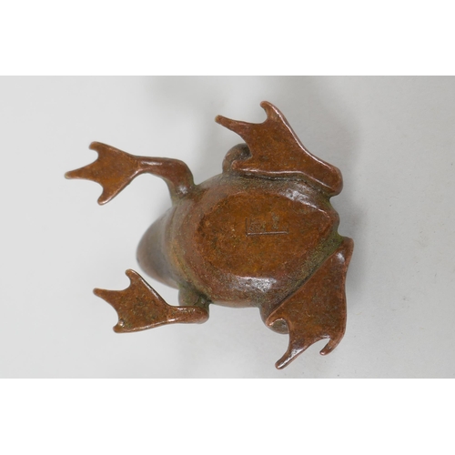 235 - A Japanese style bronze okimono frog, indistinct mark to belly, 4cm long