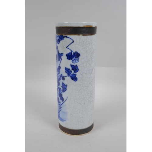 236 - A Chinese blue and white crackleware cylinder vase with bronze style bands and decorated with a bird... 