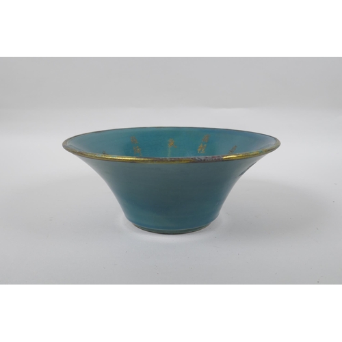 238 - A Chinese celadon glazed porcelain bowl with gilt metal mounted rim, the bowl with chased and gilt i... 