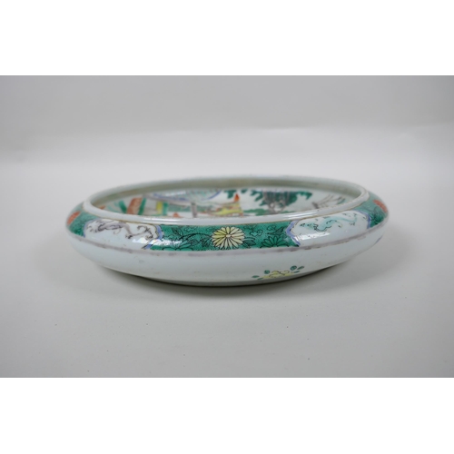 241 - A famille vert porcelain dish with rolled rim, decorated with warriors in a landscape, Chinese KangX... 