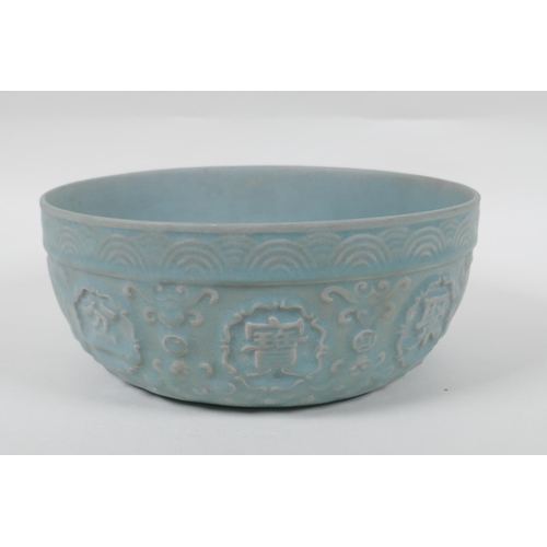 243 - A Chinese Ru ware style bowl with raised character marks and carp decoration, 21cm diameter