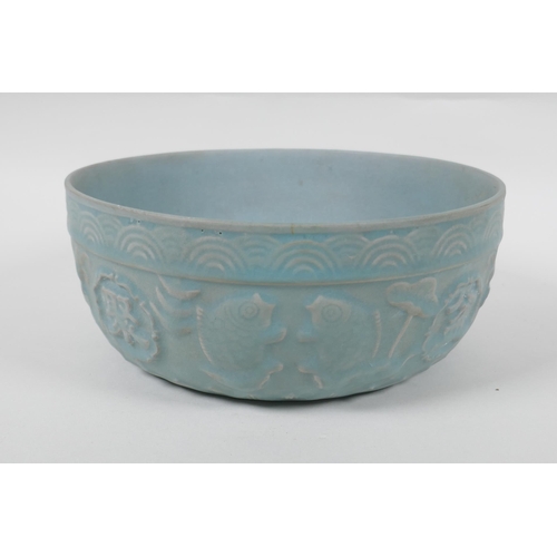 243 - A Chinese Ru ware style bowl with raised character marks and carp decoration, 21cm diameter