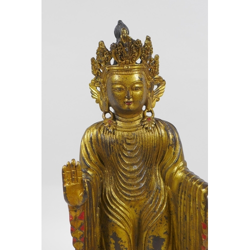 245 - A Sino Tibetan gilt bronzed metal Buddha, 32cm high