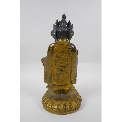 245 - A Sino Tibetan gilt bronzed metal Buddha, 32cm high