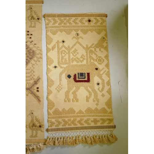 247 - Two Indian embroidered jute wall hangings with a peacock and elephant design, 160 x 74cm