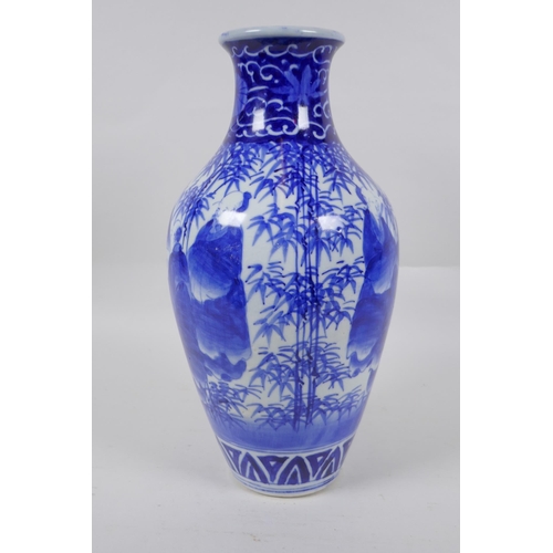 248 - A Chinese blue and white porcelain vase decorated with sages in a bamboo forest, 30cm high