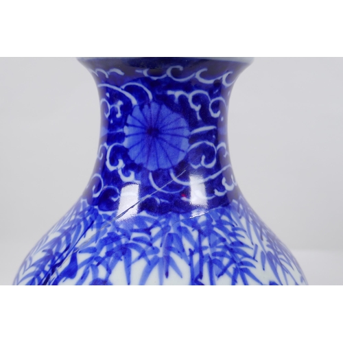 248 - A Chinese blue and white porcelain vase decorated with sages in a bamboo forest, 30cm high