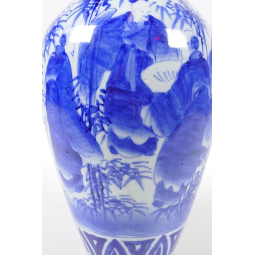 248 - A Chinese blue and white porcelain vase decorated with sages in a bamboo forest, 30cm high