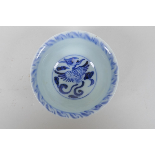 253 - A Chinese Ming style blue and white porcelain tea bowl with phoenix decoration, and a Ming style blu... 