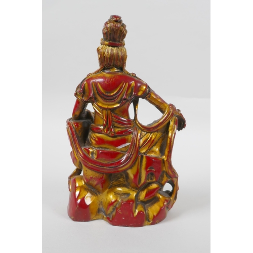 260 - A Chinese bronze figure of Quan Yin with gilt and red lacquer patina, 21cm high