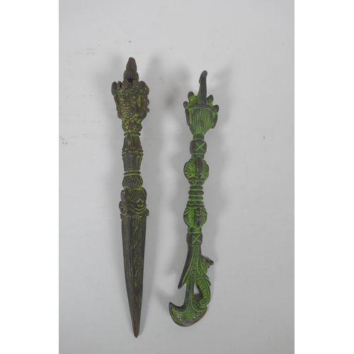 265 - A Tibetan cast iron phurba and kartika with ver de gris patina, 21cm long