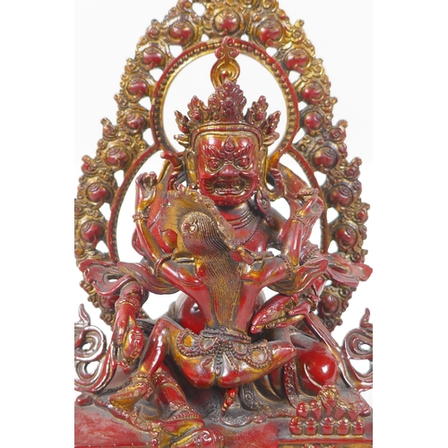 271 - A Sino Tibetan copper lacquer bronze figure of a wrathful deity with remnants of gilt patina, 24cm h... 