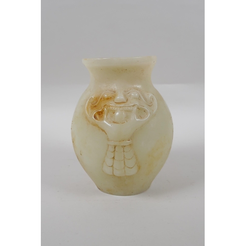 273 - A Chinese reconstituted hardstone jar with twin mask decoration, 17cm high