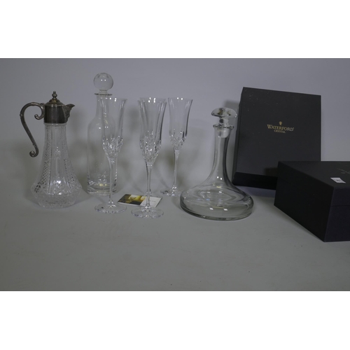 28 - Two boxed pairs of Waterford crystal 'Lismore Essence' champagne flutes, a ship's decanter and anoth... 