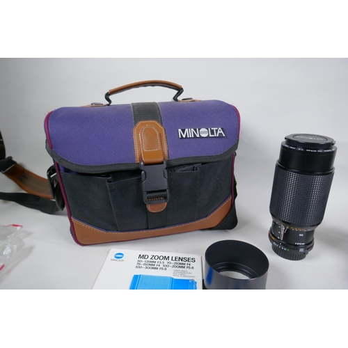 291 - A Minolta X-700 SLR camera fitted with a Soligor zoom and macro 28-55mm lens, and a collection of ac... 