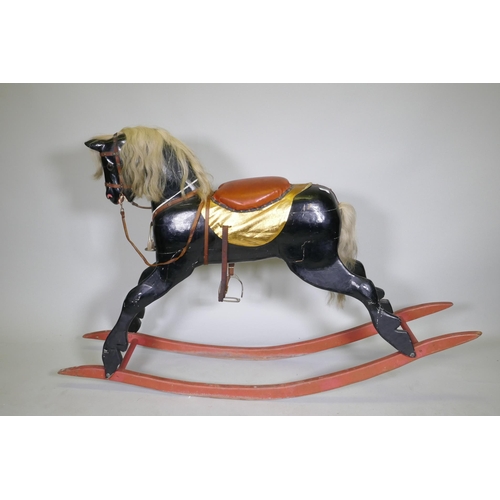 31 - A vintage painted rocking horse, 100cm high, 160cm long