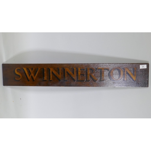 37 - An antique wooden hand painted 'Swinnerton' sign, 92 x 15cm