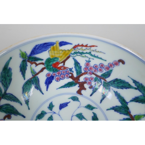 38 - A Chinese porcelain bowl with wucai enamel bird decoration to the interior and incised dragon decora... 