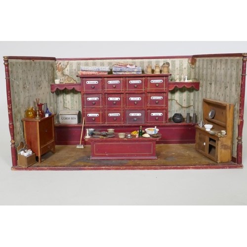 4 - An antique model of a sweet shop, with opening drawers and counter, late C19th/early C20th, 62 x 30 ... 