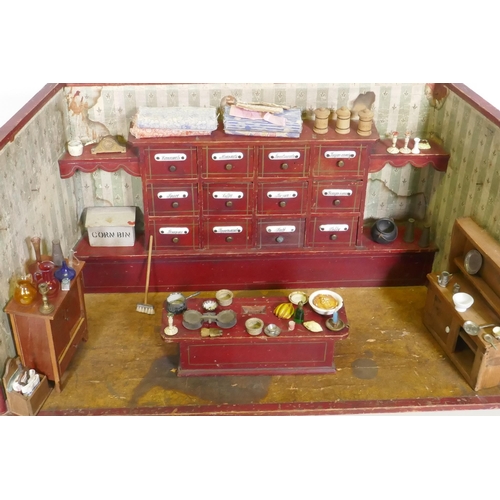 4 - An antique model of a sweet shop, with opening drawers and counter, late C19th/early C20th, 62 x 30 ... 