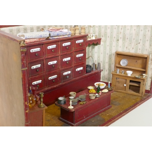 4 - An antique model of a sweet shop, with opening drawers and counter, late C19th/early C20th, 62 x 30 ... 