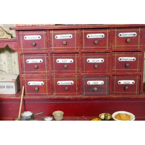 4 - An antique model of a sweet shop, with opening drawers and counter, late C19th/early C20th, 62 x 30 ... 