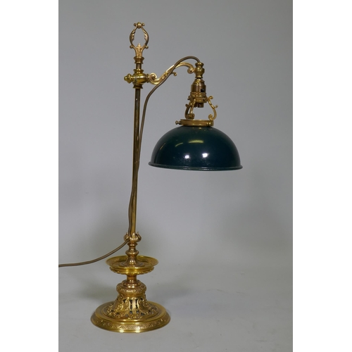 41 - An ormolu table lamp with adjustable painted toleaware shade, the base with fine engraved and pierce... 