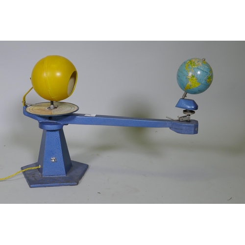 5 - A vintage German tinplate and metal tellurium, with illuminating sun, lacks crank and moon, 67cm x 4... 