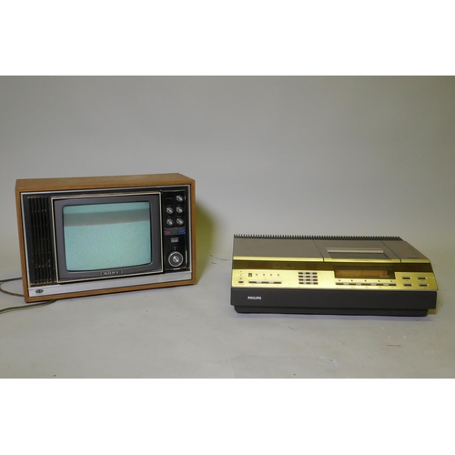 56 - A Vintage Sony Trinitron colour TV, model No KV132OVB, and a Philips VR2022 VCR