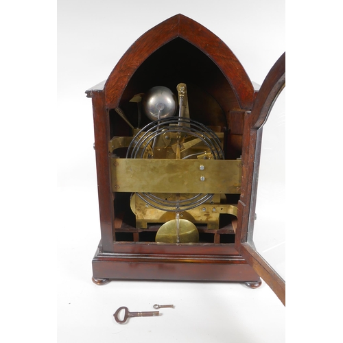 601 - A fine early C19th gothic style rosewood bracket clock, the arched case with pierced sides and clust... 