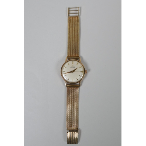 603 - A 9ct gold gentleman's Zenith Automatic wrist watch with gold hands and batons, 53g gross