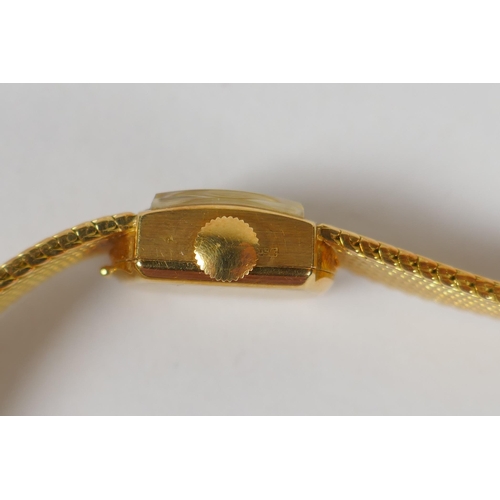 604 - An International Watch Co 18ct gold lady's cocktail watch, 33.3g gross