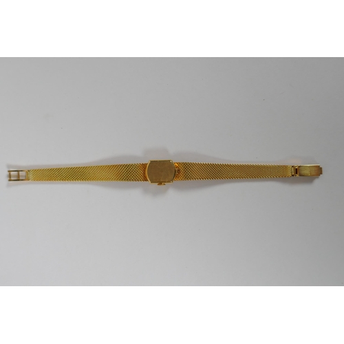 604 - An International Watch Co 18ct gold lady's cocktail watch, 33.3g gross