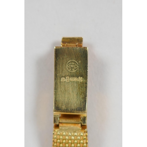 604 - An International Watch Co 18ct gold lady's cocktail watch, 33.3g gross