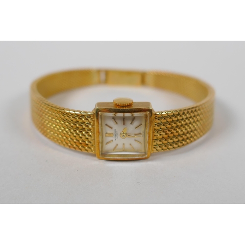 604 - An International Watch Co 18ct gold lady's cocktail watch, 33.3g gross