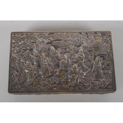 610 - A late C19th Chinese Da Xing silver box, with repousse decoration depicting the eight immortals in a... 