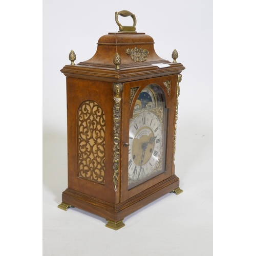 613 - A burr walnut cased bracket clock, the brass dial with sun and moon phase, silvered chapter ring and... 