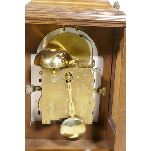 613 - A burr walnut cased bracket clock, the brass dial with sun and moon phase, silvered chapter ring and... 