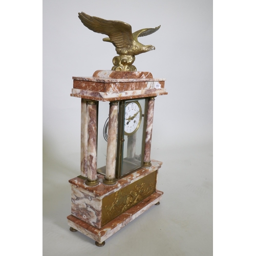 617 - A C19th French rouge marble clock with bronze mounts, the case surmounted by an eagle signed L. Caru... 