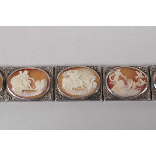 618 - An antique silver cameo bracelet with Greco Roman decorative panels, and a matching ring, size L/M