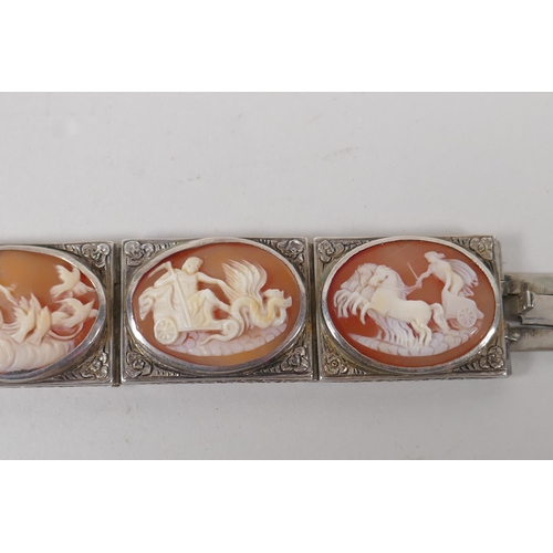 618 - An antique silver cameo bracelet with Greco Roman decorative panels, and a matching ring, size L/M