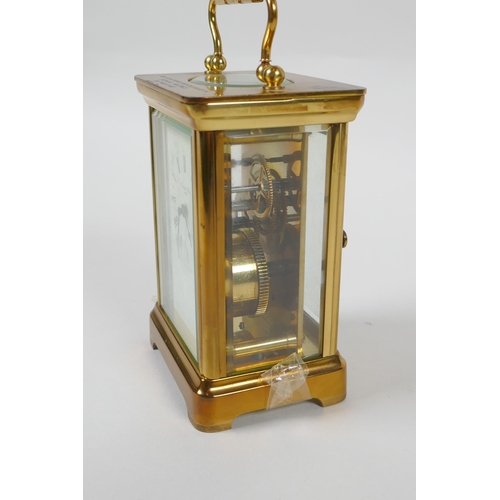 621 - A brass cased Henley carriage clock, retailed by Charles Greig, the dial with Roman numerals, 8 x 6c... 